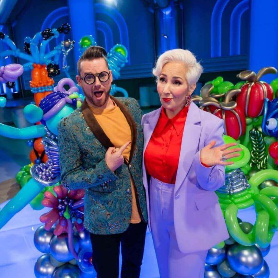 Dave Brenn and guest at balloon art event with vibrant decor